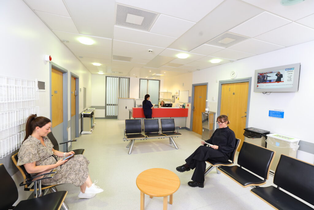 A photo of people sat in the laser skin clinic