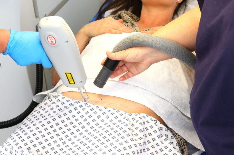 Medical professionals conducting a laser treatment